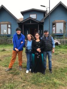 a group of people standing in front of a house at Casa Sra Oti in Puerto Montt