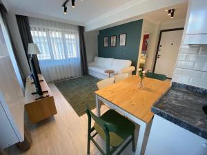 a living room with a table and a couch at Sisli Central Apartments in Istanbul