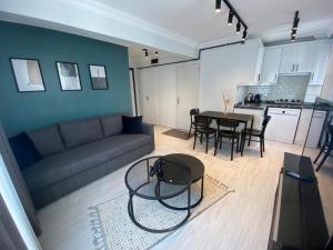 a living room with a couch and a table at Sisli Central Apartments in Istanbul