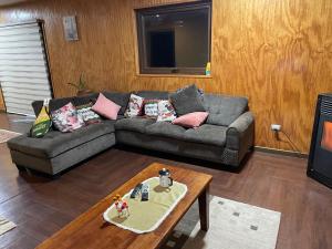 a living room with a couch and a coffee table at Casa Sra Oti in Puerto Montt
