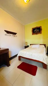 Postel nebo postele na pokoji v ubytování HOTEL El INDIO