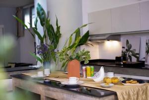 a kitchen with a table with food on it at Chiang Mai luxury condo hidden in the city in Chiang Mai