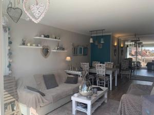 Posezení v ubytování Le Wembley Superbe appartement + 4 fotografie