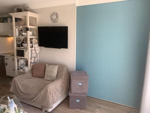 TV a/nebo společenská místnost v ubytování Le Wembley Superbe appartement