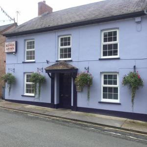 a white house with plants on the front of it at Kings Arms in Llandysul