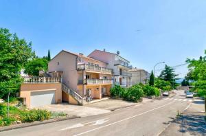 an apartment building on the side of a street at Apartment in Crikvenica with One-Bedroom 4 in Crikvenica