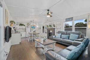 a living room with a couch and a table at Boat and Fish on Lewisville Lake Pet-Friendly Haven in Lake Dallas