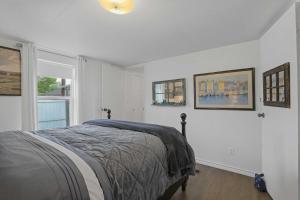 a white bedroom with a bed and a window at Boat and Fish on Lewisville Lake Pet-Friendly Haven in Lake Dallas