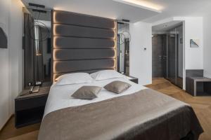 Ein Bett oder Betten in einem Zimmer der Unterkunft Hotel Cittar