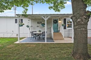 a house with a table and chairs on the porch at Boat and Fish on Lewisville Lake Pet-Friendly Haven in Lake Dallas