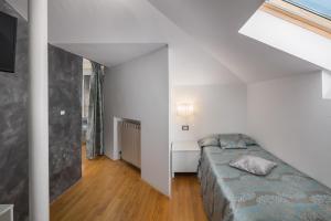 Ein Bett oder Betten in einem Zimmer der Unterkunft Hotel Cittar