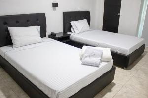Letto o letti in una camera di Hotel Fenix