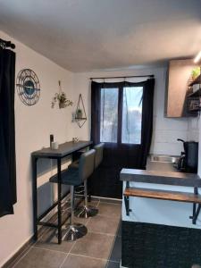 a kitchen with a counter and a table and a sink at Casa di Angelo in Kos Town