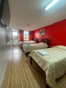 Postel nebo postele na pokoji v ubytování HOTEL El INDIO