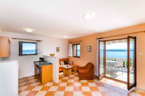 a living room with a view of the ocean at Two-Bedroom Apartment Crikvenica 5 in Dramalj