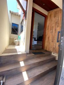 a view of the front door of a house at Casa triplex com cobertura a 5 minutos da praia in Arraial do Cabo +7 photos