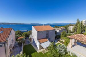 an aerial view of a house with a view of the water at One-Bedroom Apartment in Crikvenica LXIII in Dramalj