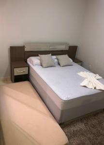 a bedroom with two beds at Flat Hotel in Guanambi