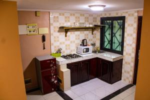 Kuchyň nebo kuchyňský kout v ubytování Residence Le Carat