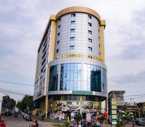 a building with a sign on the front of it at Residence Le Carat in Douala