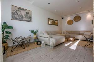 a living room with a couch and a table at Holiday home in Crikvenica 5239 in Dramalj