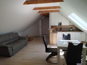 a living room with a couch and a table at u Tymka in Iława