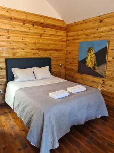 a bedroom with a bed with two towels on it at FALCOARIA Setubal in Setúbal +72 photos