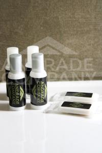 a group of three bottles of hair products on a table at Casa da Padaria Antiga 2 in Pinhão