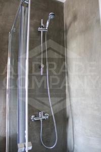 a shower with a shower head in a bathroom at Casa da Padaria Antiga 2 in Pinhão