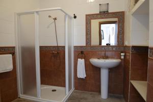 a bathroom with a shower and a sink at Casa Rural Las Cadenas del Cananeo in Arcos de la Frontera +52 photos