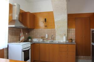 A kitchen or kitchenette at Evanthea Residence