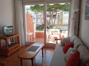 Televízia a/alebo spoločenská miestnosť v ubytovaní Precioso Apartamento Gran Reserva