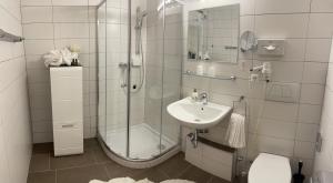 Kúpeľňa v ubytovaní Seehaus "Kärnten Inn" mit direktem Seezugang und E-Ladestation