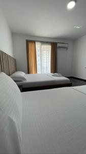 Postel nebo postele na pokoji v ubytování Hotel LEODORI 3 suites