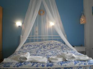 Postel nebo postele na pokoji v ubytování Sunrise Flora