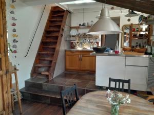 Kuchyňa alebo kuchynka v ubytovaní La maison du Caï + 4 fotografie