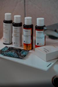 a group of four prescription bottles sitting on a table at Makis Inn Resort in Thermisía