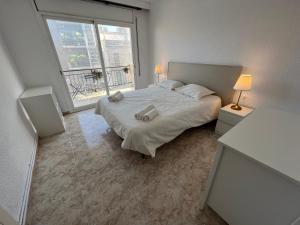 Postel nebo postele na pokoji v ubytování La Carmeta Apartament