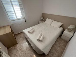 Postel nebo postele na pokoji v ubytování La Carmeta Apartament