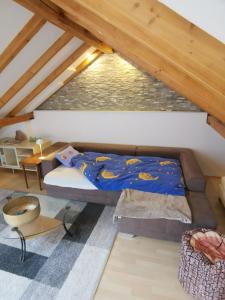 a bedroom with a bed in a attic at Modern Chalet Style in traditional village home with free WiFi & optional Wallbox 