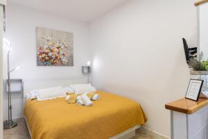 Posteľ alebo postele v izbe v ubytovaní Guest House Tomasi + 4 fotografie