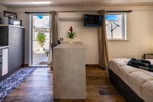 a living room with a couch and a table at Casa Vacanze RetroScena in Avola