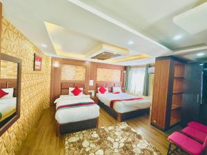 Rúm í herbergi á Hotel Airport Deepshree