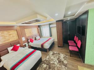 Rúm í herbergi á Hotel Airport Deepshree