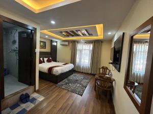 Rúm í herbergi á Hotel Airport Deepshree