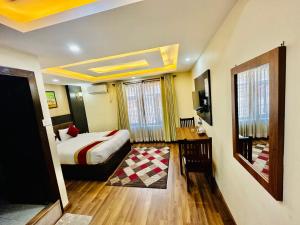 Rúm í herbergi á Hotel Airport Deepshree