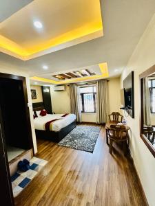 Rúm í herbergi á Hotel Airport Deepshree