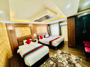 Rúm í herbergi á Hotel Airport Deepshree