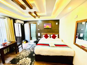 Rúm í herbergi á Hotel Airport Deepshree