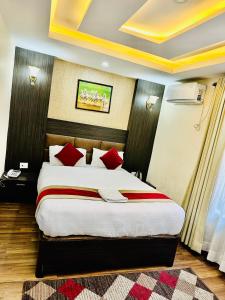 Rúm í herbergi á Hotel Airport Deepshree